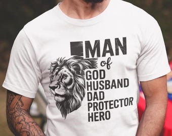 Man of God Husband Protector Dad Hero Shirt | Christian Dad T-Shirt | Father’s Day Gift for Husband | Religious Men's Tee
