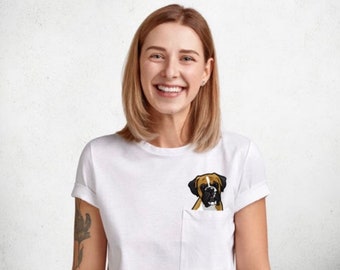 May include: A white t-shirt with a pocket featuring an embroidered image of a brown and white boxer dog.
