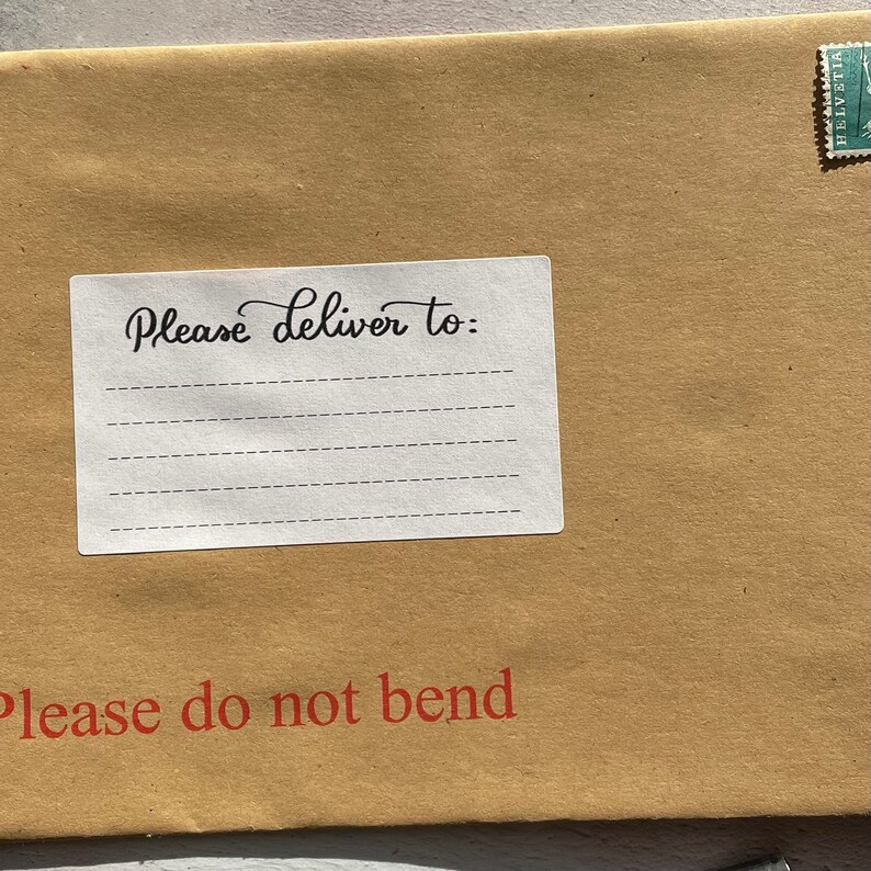 May include: A brown paper envelope with a white label that says "Please deliver to:" and has lines for writing an address. The envelope also has a red stamp that says "Please do not bend."