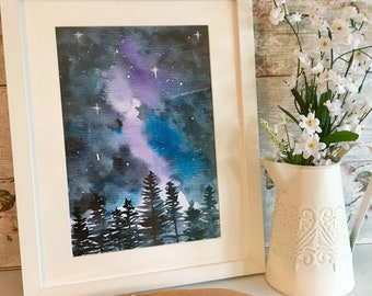 May include: A framed watercolor painting of a dark forest with a purple and blue galaxy in the night sky.