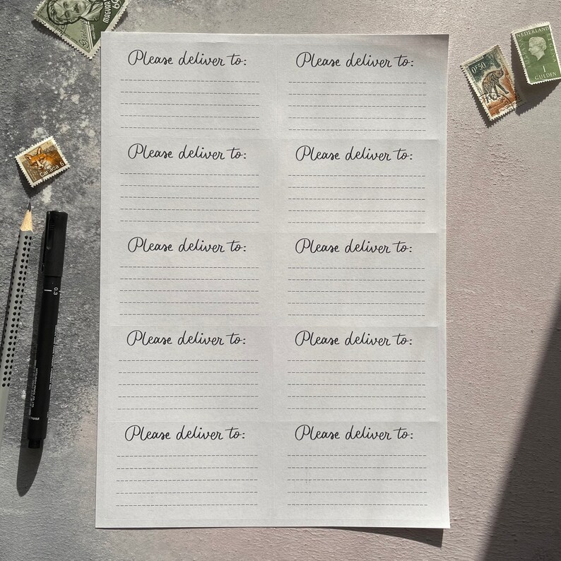 May include: A white sheet of paper with five lines on each side, with the text "Please deliver to:" written at the top of each side.