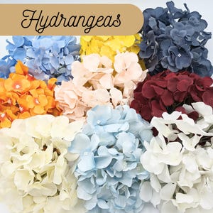 May include: Assortment of artificial hydrangea flower heads in various colors, including blue, light blue, white, cream, peach, orange, burgundy, and yellow.