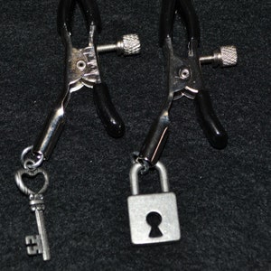 Tepelklemmen met slot en sleutel: verstelbare metalen hangers