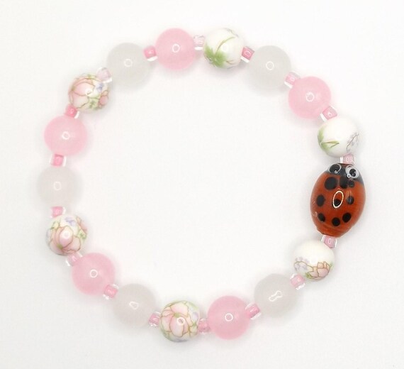 Stretch Bracelet with Ladybug Lampwork Glass Focal Bead and Pink, White Glass Floral Flower Beads, Handmade USA Spockles
