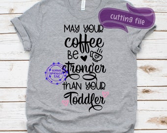 May include: Gray t-shirt with the text "May your coffee be stronger than your toddler" in black with a pink heart and coffee cup graphic.