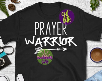 May include: Black t-shirt with white text that reads "PRAYER WARRIOR" and a white arrow with a sun graphic. The text "cut file" is in a purple circle with a green outline. The text "sunset sprinkle SVG" is in a green circle with a pink sun graphic.