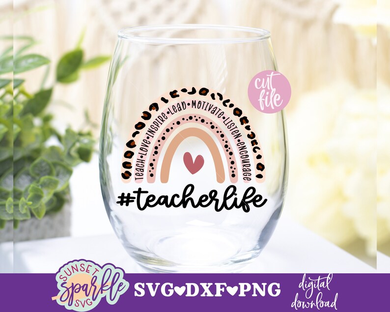 May include: A pink and brown rainbow with the words "Teach-Love-Inspire-Lead-Motivate-Listen-Encourage" around it. The rainbow has a small pink heart in the center. Below the rainbow is the text "#teacherlife".