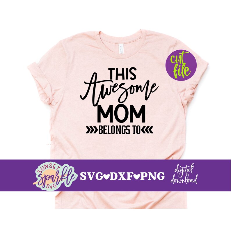 May include: A pink t-shirt with the text "This Awesome Mom Belongs To" in black. The text is in a handwritten style font. The shirt is a digital download file.