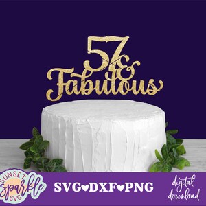 May include: Gold glitter cake topper with the text "57 & Fabulous" on a white cake.