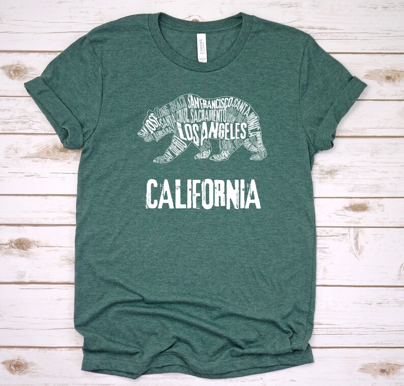 May include: A green t-shirt with a white outline of a bear made up of California city names. The text "CALIFORNIA" is below the bear.