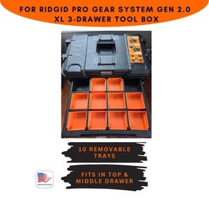 May include: Black Ridgid Pro Gear System XL 3-Drawer Tool Box with orange removable trays. The tool box has the text "RIDGID" on the front. The image also includes the text "10 REMOVABLE TRAYS" and "FITS IN TOP & MIDDLE DRAWER".