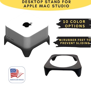 May include: A black stand for an Apple Mac Studio computer. The stand has a square base with four legs and a circular top. The stand is made of plastic and has rubber feet to prevent sliding. The stand is available in 10 colors. The stand is American made.