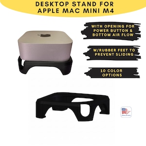 May include: A black desktop stand for an Apple Mac Mini M4. The stand has an opening for the power button and bottom air flow, and rubber feet to prevent sliding. The stand is shown with a Mac Mini on top. The text says "10 COLOR OPTIONS".