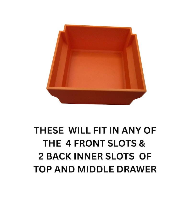 May include: An orange plastic storage bin with a rectangular shape and stepped sides. The text on the image reads: THESE WILL FIT IN ANY OF THE 4 FRONT SLOTS & 2 BACK INNER SLOTS OF TOP AND MIDDLE DRAWER.