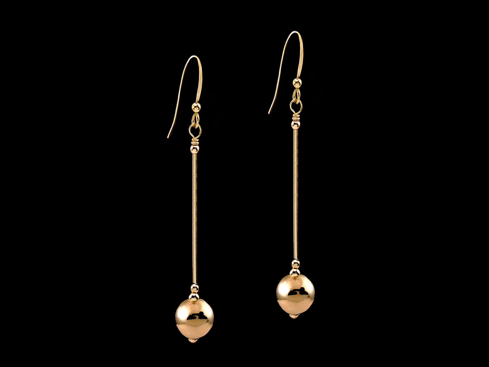 5-8mm Polished Hollow Ball Bead 14k Yellow Gold Dangling Drop Leverback Earrings 5-8mm Polished Hollow Ball Bead 14k Yellow Gold Dangling Drop Leverback Earrings