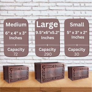 May include: Three wooden cremation urns in different sizes: small, medium, and large. The urns are made of dark wood with a carved floral design. The urns are displayed on a wooden surface. The dimensions and capacity of each urn are listed below each urn.