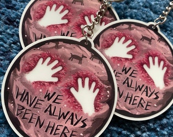 We Have Always Been Here 2.25" Glow In The Dark Acrylic Charm Keychain - Classics But Make It Gay