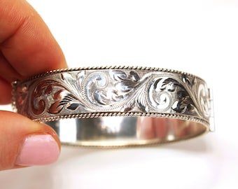 Vintage solid silver sterling cuff bangle bracelet with an engraved pattern on both sides. Birmingham hallmarks dated 1983