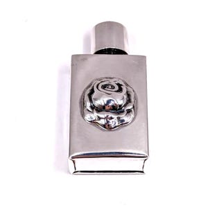 Vintage sterling silver & glass perfume bottle with a rose. London hallmarks dated 1994