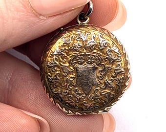 Victorian rose gold-plated round shaped richly engraved locket pendant