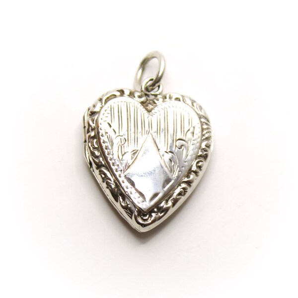 Art Deco sterling silver heart shaped locket pendant. Birmingham hallmarks dated 1915