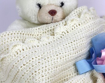 Traditional white wool knitted blanket for babies, handmade with crochet