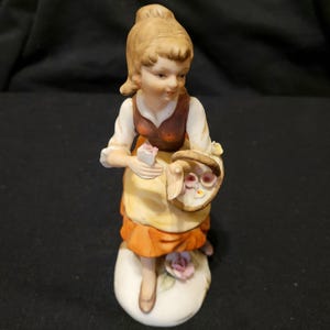 Vintage Lady Figurine Ceramic Girl With Brown Hair Woman Holding Basket of Flowers