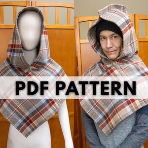 May include: A plaid hooded cape, shown on a mannequin and a person. The cape has a grey base with red, blue, and white plaid lines. The image includes the text "PDF PATTERN".