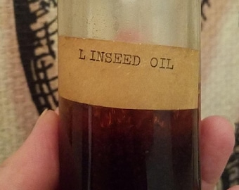 Aesthetically Creepy Old Glass Bottle of Linseed Oil