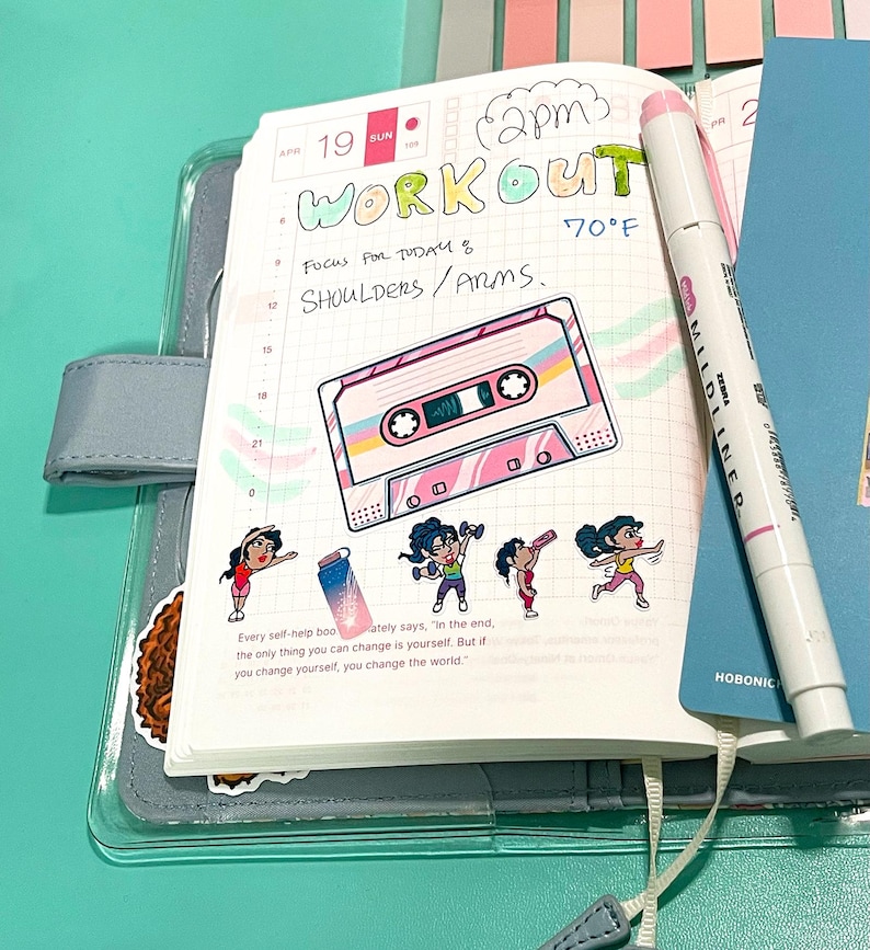 workout stickers applied on a Hobonichi planner A6 page. Fitness stickers with different poses used on a health/fitness journal and a cassette tape sticker with bright pinks, teals, yellow colors