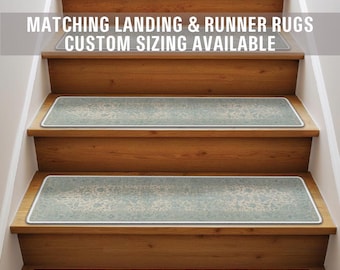 May include: A set of blue and white patterned stair treads with a white border. The text "Matching Landing & Runner Rugs Custom Sizing Available" is displayed above the stairs.