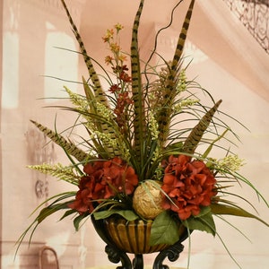 Grasses and Feathers Faux Floral Design with Burgundy Hydrangeas in Bamboo Motif Vase