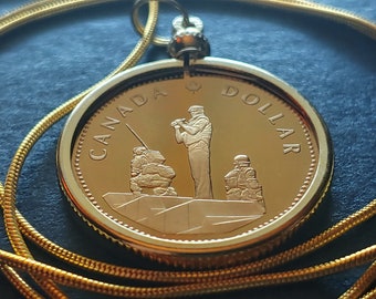 1995 Canada Reconciliation Ottawa Peacekeeping Monument Proof Dollar Pendant on a 24" 18KGF Gold Filled Snake Chain.