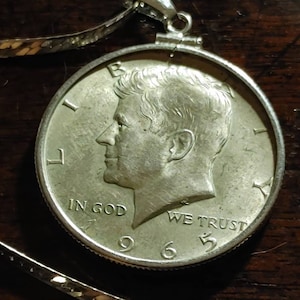 Mint condition 1965 silver Kennedy half dollar coin pendant on a 30&quot; Sterling silver herringbone necklace. Mint details. 2.5mm chevron chain