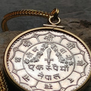 Nepal Rupee Himalayan mountain top &quot;Trident of Shiva sword of Kali&quot; Coin pendant on a 18&quot; gold filled foxtail chain. 28mm 12kt 1/20th gold