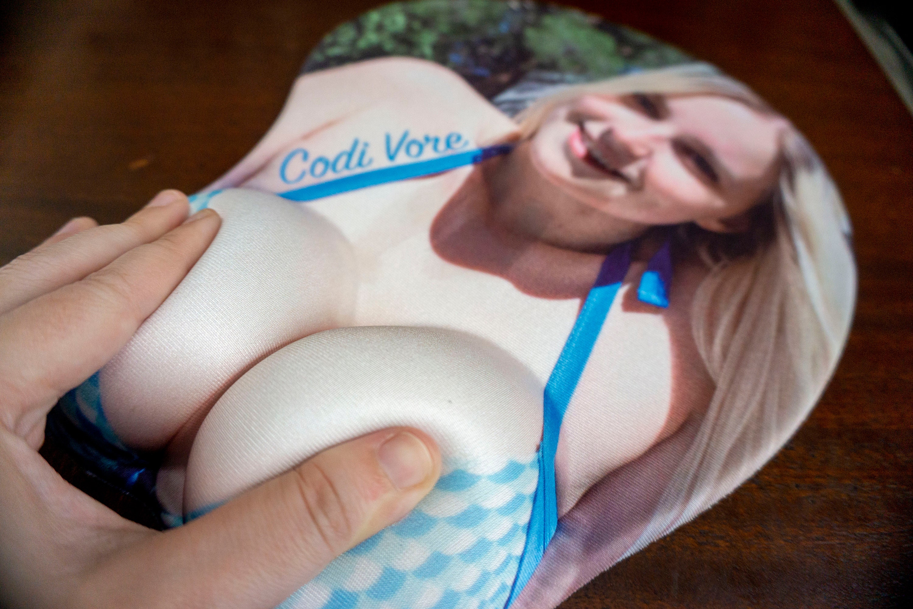 This large ergonomic mouse pad has big, squishy lumps with cleavage for sli...