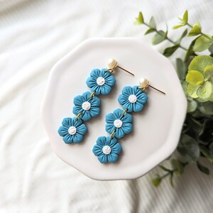 Pearly Flower Dangles. Springtime earrings. Floral jewelry. Handmade spring jewelry. Blue flower earrings. Lightweight polymer clay earrings