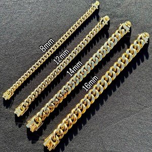 May include: Four gold chain necklaces of different widths, laid out on a gray surface. The chains are labeled with their widths in millimeters: 8mm, 12mm, 14mm, and 16mm.
