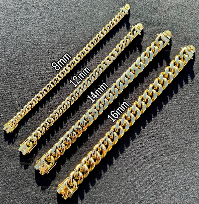 May include: Four gold chain necklaces of different widths, laid out on a gray surface. The chains are labeled with their widths in millimeters: 8mm, 12mm, 14mm, and 16mm.