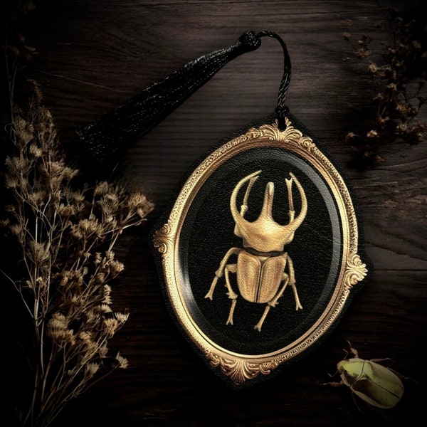 In the garden. Bookmark, decoration. Faux leather fabric, gold beetle frame