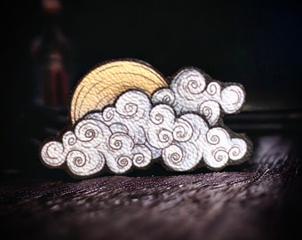 Broche. Dans les nuages