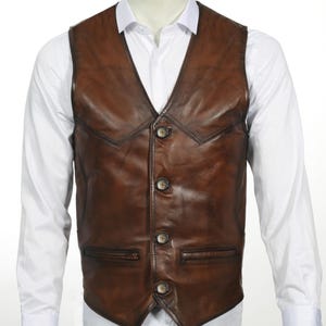 Elevate your style with this handcrafted Leather Vest Men in rich brown sheepskin. Perfect for cowboy, biker, motorcycle, or western fashion enthusiasts, this waistcoat blends timeless appeal with superior craftsmanship. Made from 100% genuine lamb leather, it offers a luxuriously soft feel and durable wear that ages beautifully over time.