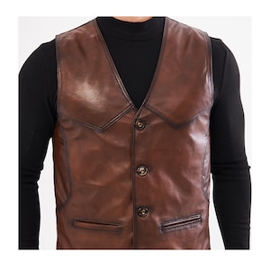 Elevate your style with this handcrafted Leather Vest Men in rich brown sheepskin. Perfect for cowboy, biker, motorcycle, or western fashion enthusiasts, this waistcoat blends timeless appeal with superior craftsmanship. Made from 100% genuine lamb leather, it offers a luxuriously soft feel and durable wear that ages beautifully over time.