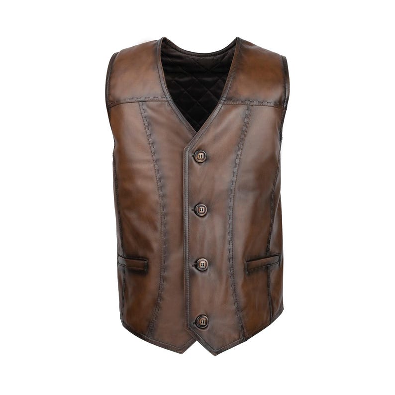 Discover the timeless elegance and rugged charm of our Men's Leather Vest, Soft Brown Leather Waistcoat, a true testament to craftsmanship and style. Handmade in Turkey from 100% genuine lambskin, this leather vest offers unparalleled softness, flexibility, and breathability—making it perfect for both casual layering and more refined occasions. The classic fit ensures all-day comfort, while the Punto stitching details add a sophisticated, polished touch to this versatile piece.