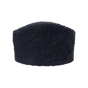 May include: A dark navy blue headband crafted from a thick, textured sherpa fleece material. The accessory features a rounded, cylindrical shape with a dense, curly pile surface that provides a uniform appearance across the entire exterior.