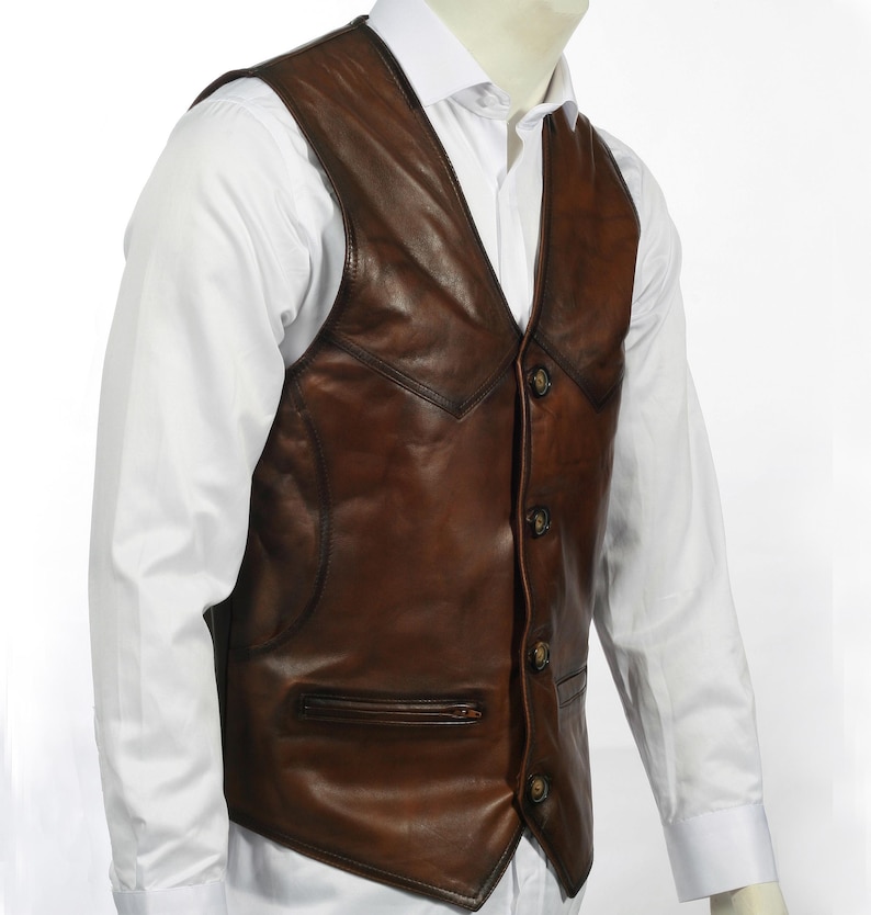 Elevate your style with this handcrafted Leather Vest Men in rich brown sheepskin. Perfect for cowboy, biker, motorcycle, or western fashion enthusiasts, this waistcoat blends timeless appeal with superior craftsmanship. Made from 100% genuine lamb leather, it offers a luxuriously soft feel and durable wear that ages beautifully over time.
