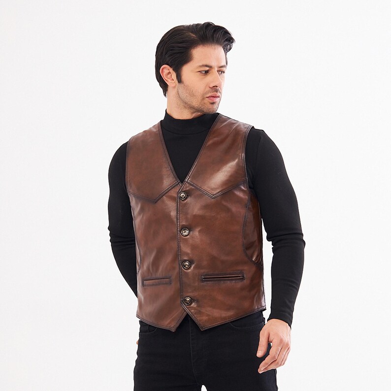 Elevate your style with this handcrafted Leather Vest Men in rich brown sheepskin. Perfect for cowboy, biker, motorcycle, or western fashion enthusiasts, this waistcoat blends timeless appeal with superior craftsmanship. Made from 100% genuine lamb leather, it offers a luxuriously soft feel and durable wear that ages beautifully over time.