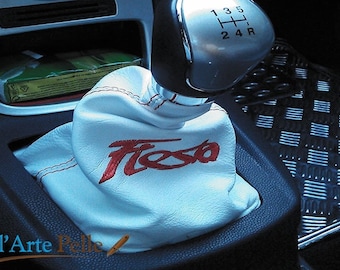 May include: White leather gear shift boot with red stitching and the word "Fiesta" embroidered in red.