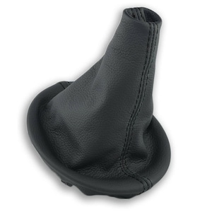 May include: Black leather gear shift boot with a stitched seam.