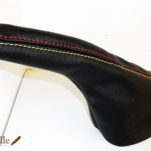 Grande Punto EVO Abarth coating the brake lever to the hand stitching of red and yellow
